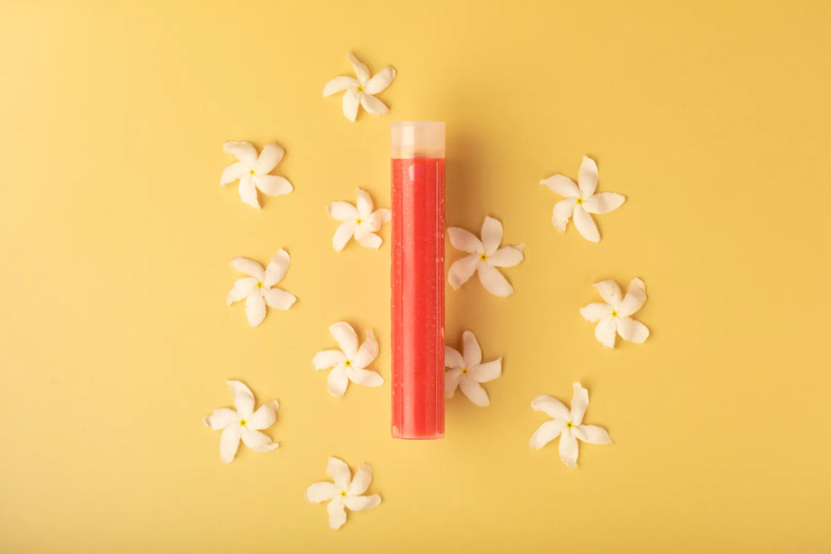 Luscentra jasmine vitamin C capsule with jasmine flowers on yellow.