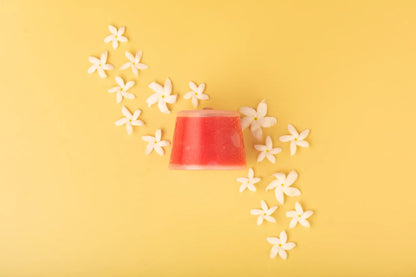 Luscentra jasmine vitamin C capsule with jasmine flowers on yellow.
