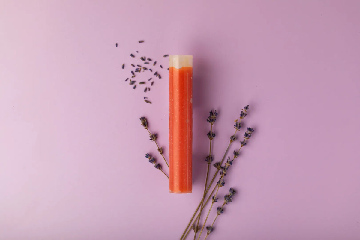 Luscentra lavender vitamin C capsule styled with lavender sprigs.