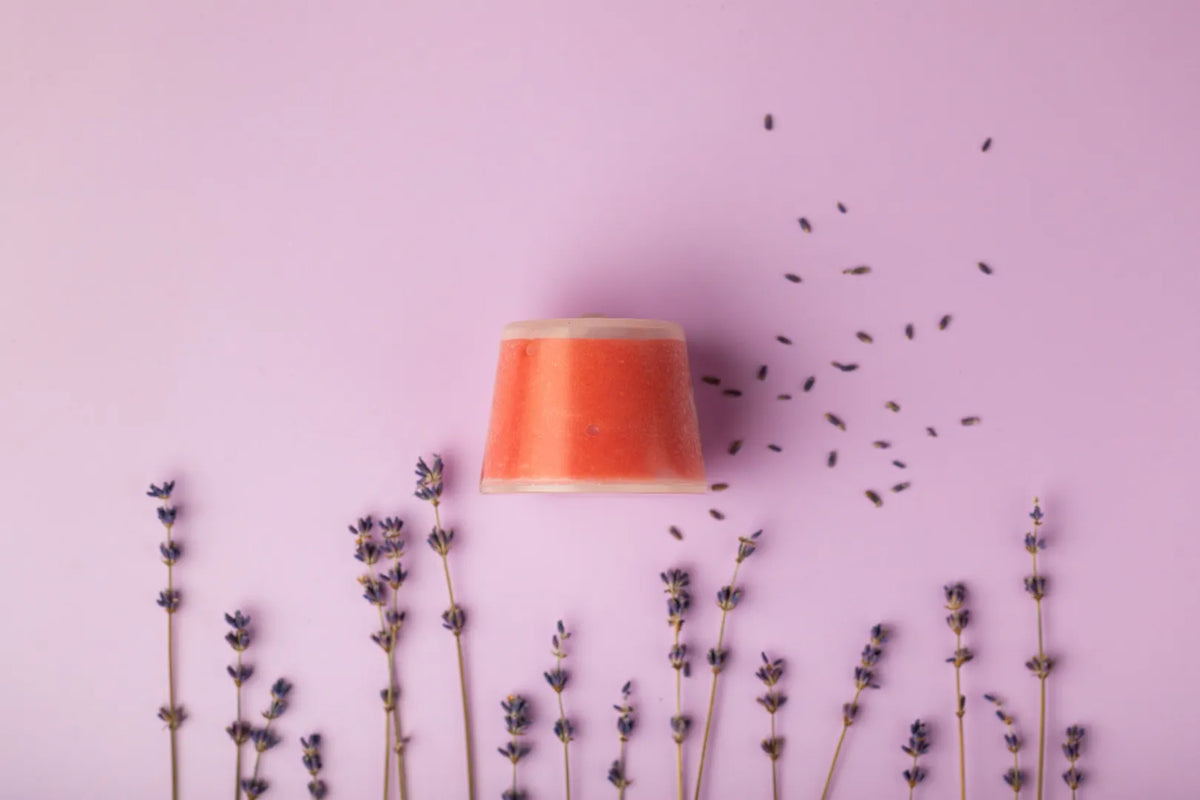 Luscentra lavender vitamin C capsule styled with lavender sprigs.