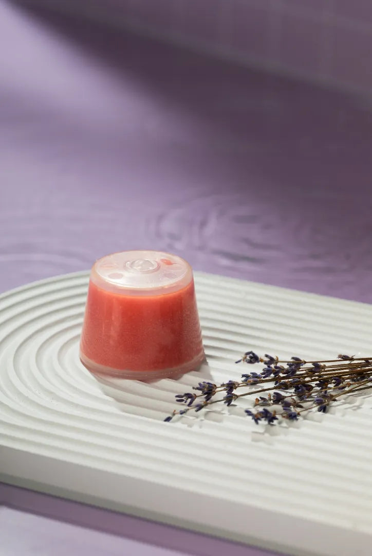 Luscentra lavender wall-mount capsule with lavender sprigs on purple.