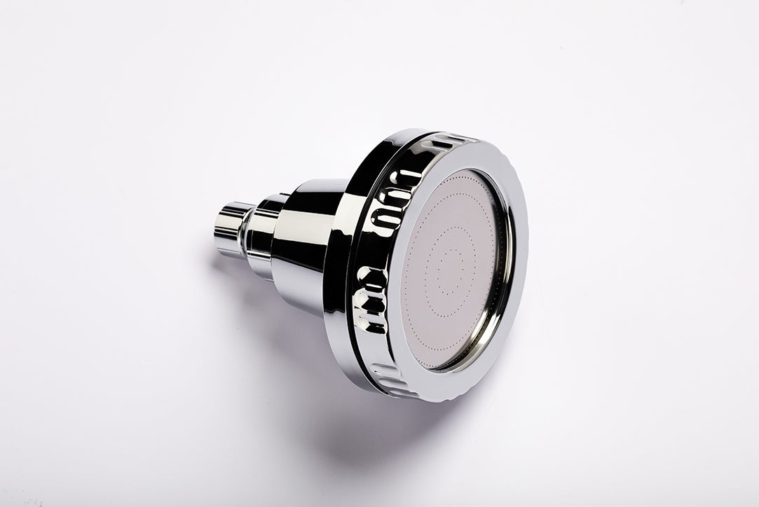 Luscentra wall mount showerhead showing the front spray plate.