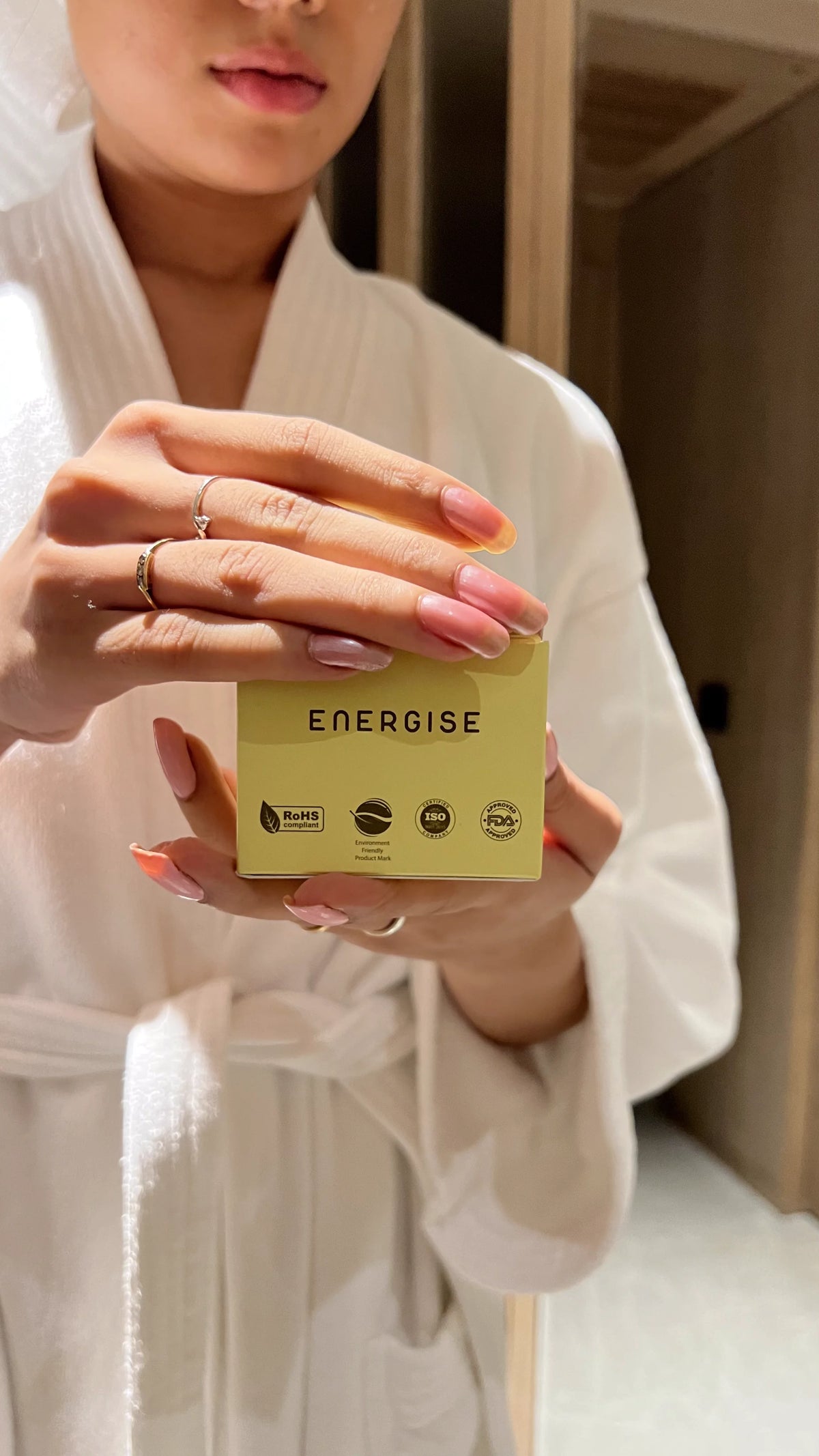 Person holding a Luscentra vitamin C shower-capsule package.