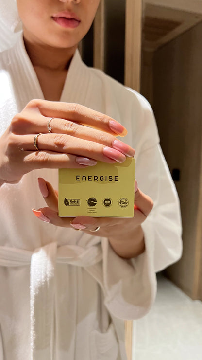 Person holding a Luscentra vitamin C shower-capsule package.