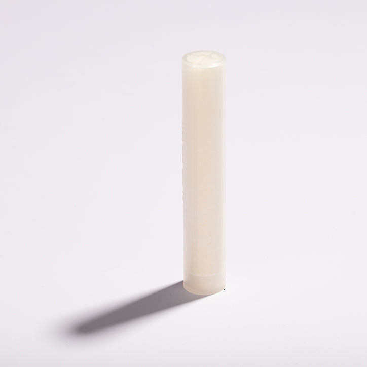 Round white Luscentra microfibre shower-filter cloth.