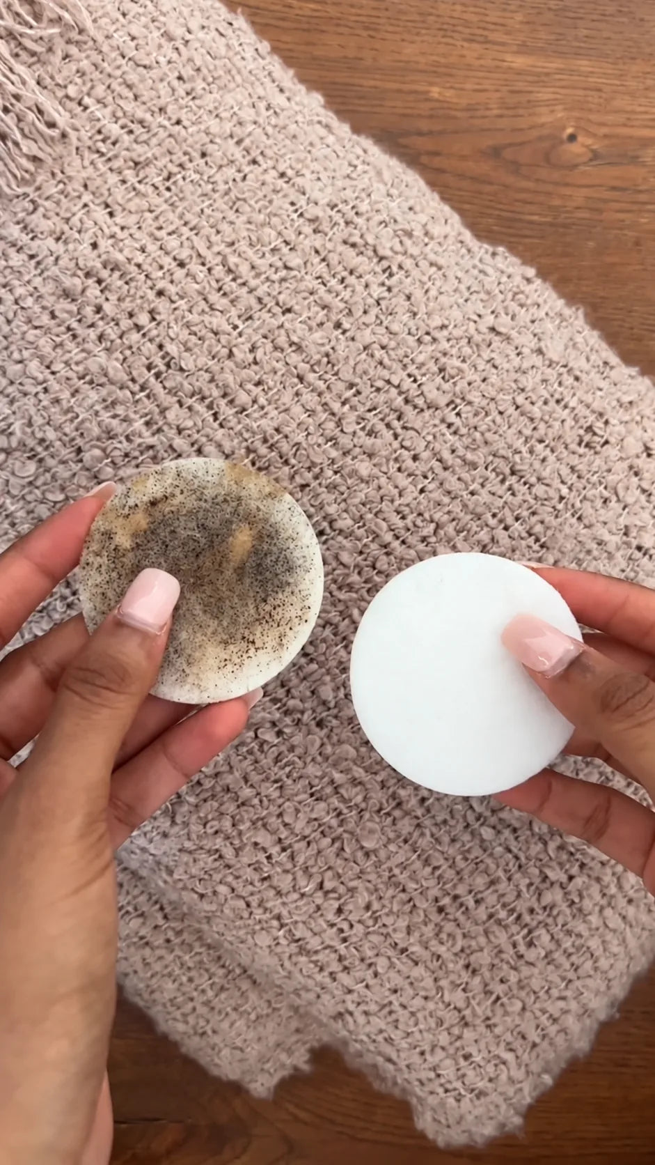 A used microfibre shower filter held beside a clean replacement filter.